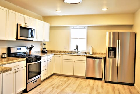 New kitchen including appliances, cabinets, and accessories