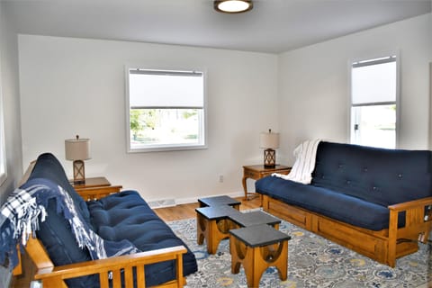 Living Room with two queen size futons and tv