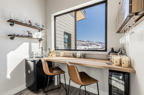 At the top of the stairs, a handmade bar with gorgeous views!