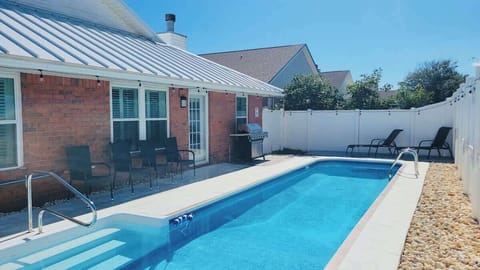 Awesome fenced back yard with private heated pool