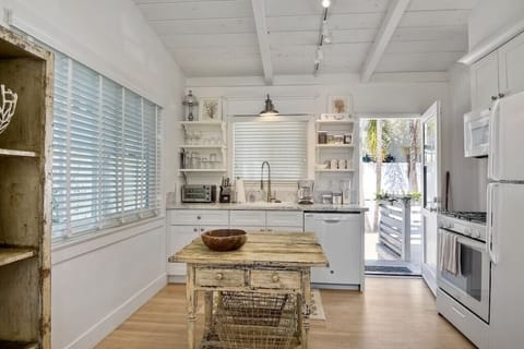 Kitchen view with gas stove/oven. Dish washer and fridge with ice maker.
