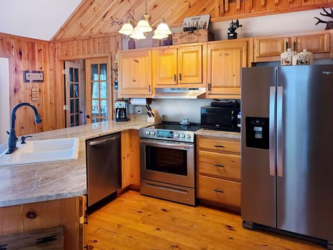 Alternate kitchen shot showing refrigerator