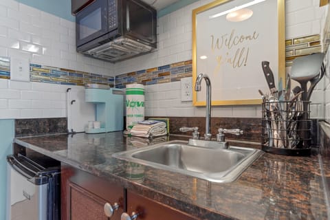 Kitchenette with cooking and coffee essentials