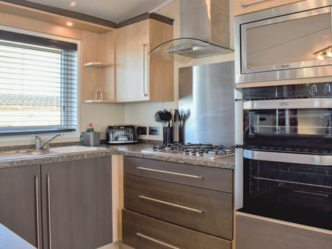 Kitchen area | Victoria Lodge - Bron Y Wendon Holiday Park, Llanddulas, near Llandudno