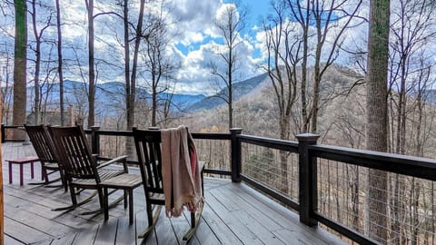 [Back Deck] Relax on a rocking chair and admire the early spring mountain views.