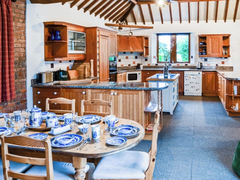 Why not have breakfast in the kitchen, it makes life easy and relaxing, also a great place for card games | Lodge Farm Barn, South Walsham