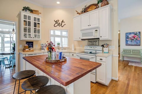 Enjoy drinks & snacks while gathering at the island & still see the water.