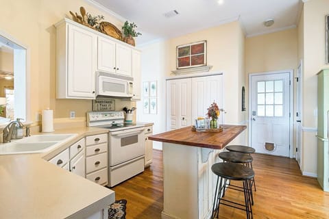 This kitchen provides all you'd need & has a washer & dryer area as well.