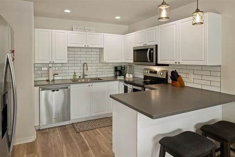 The kitchen is fully-equipped with modern appliances