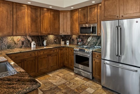 The kitchen is modern and fully-equipped