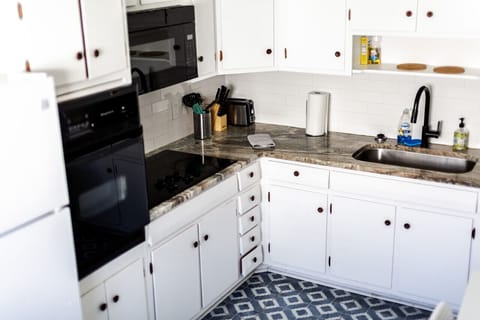 Cook up your favorite meals in style! Our fully-equipped kitchen features a fridge, freezer, microwave, oven, electric stove, Keurig & drip coffee maker combo, and more.