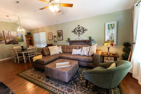Welcome to a warm & comforting front great room with living & dining areas