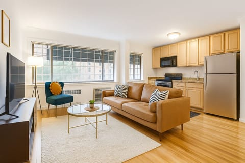 Modern and inviting open-concept living space featuring a sleek kitchen 