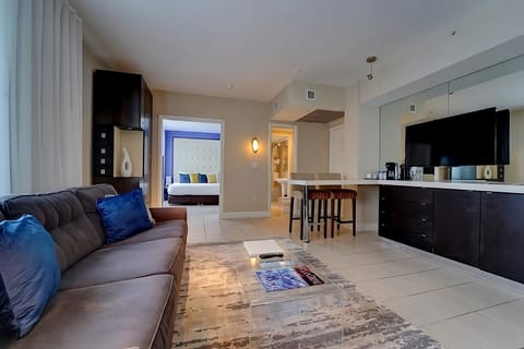 Flow seamlessly from lounging to sleeping in this open-plan suite.