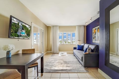 Unwind together in a stylish living space with bold accents.