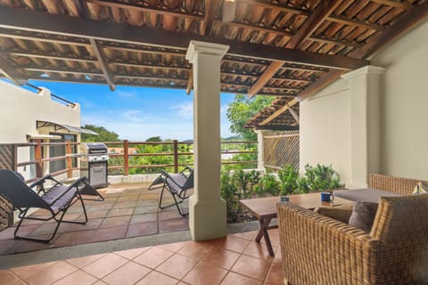 Coco Sunset Hills 40's front patio offers lots of room for relaxing and grilling