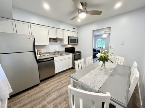 Eat in kitchen featuring  stainless steel appliances.