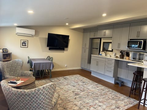 Big screens in main room and bedroom, Sonos , HVAC heat/AC. 