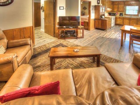 Open living area and covered deck on the river