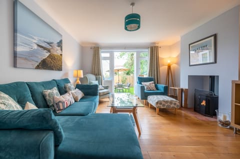 South View, West Runton: Spacious sitting room with wood burning stove and french doors leading to the enclosed garden
