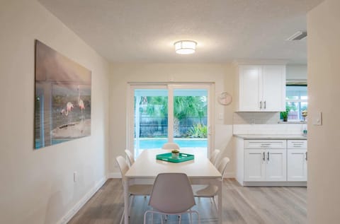 Dining room with doors to pool