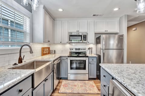 fully stocked kitchen with ice maker and wine fridge in the island!