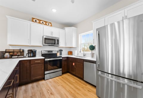 This modern kitchen is fully equipped, offering everything you need to whip up a delicious meal during your stay.