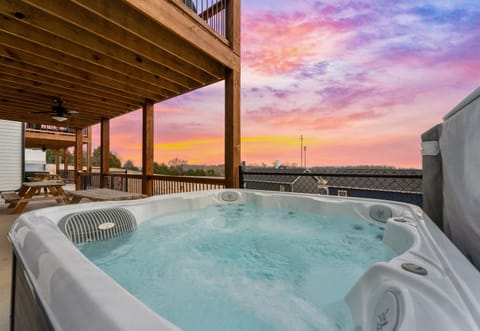 Enjoy a relaxing soak in the hot tub while taking in the stunning sunset views—a perfect end to any day.