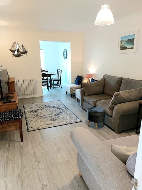 Living room leading to dining area and rear garden