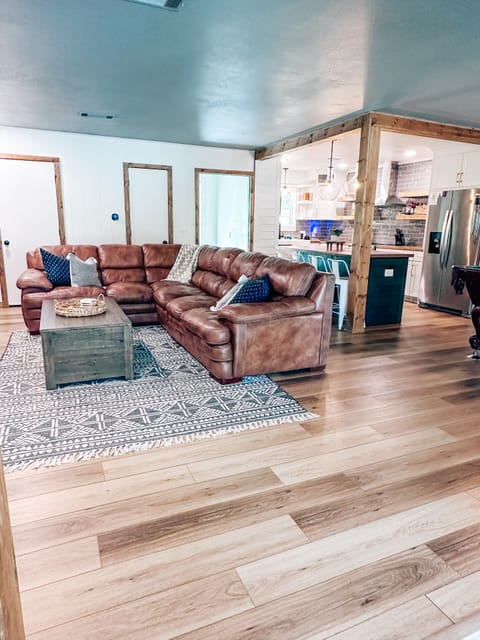 Main House Living Room- open floor plan into kitchen, dining room, & pool table