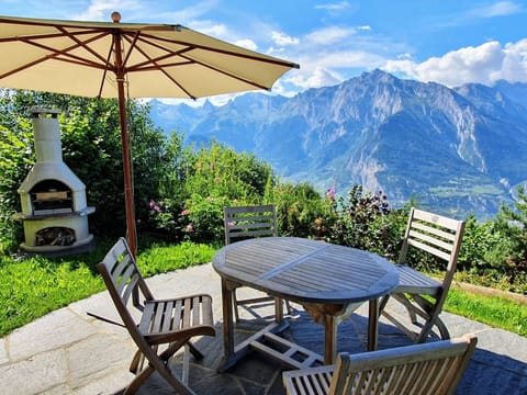 Plant, Table, Sky, Furniture, Property, Cloud, Mountain, Nature, Azure, Umbrella