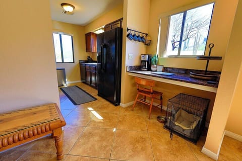 coffee bar and work space for those Zoom meetings.  Entrance to the fully-equipped kitchen.