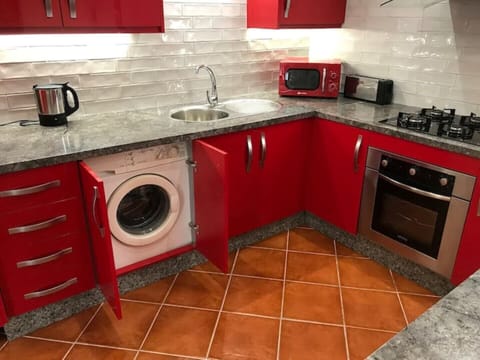 Kitchen area with washing machine 