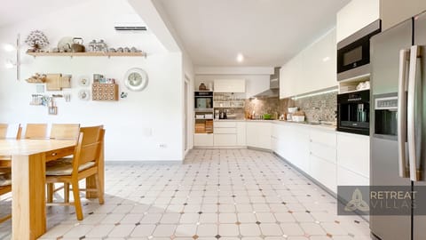 Connected with dinning area with nice garden view and exit to enclosed BBQ area