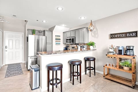 Breakfast bar with 3 stools. Coffee cart with keurig and regular drip coffee pot