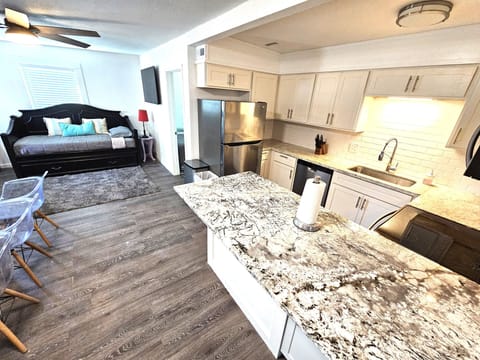 Daybed with twin mattress on top and another twin mattress below in the trundle.