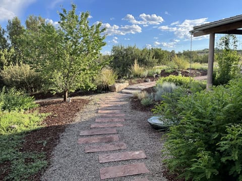 View from the front door looking out to serene courtyard with soothing fountain
