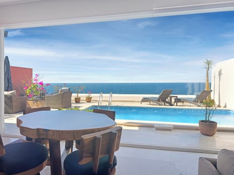 Breakfast table with views of the pool, patio, and the Bay of Banderas.