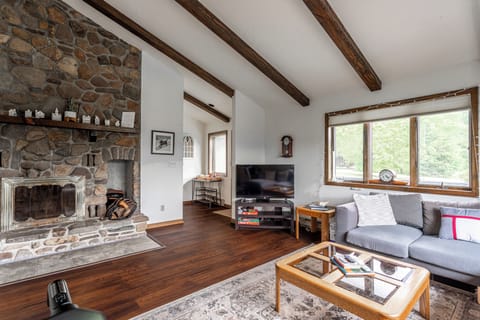 Living room with real log fireplace 