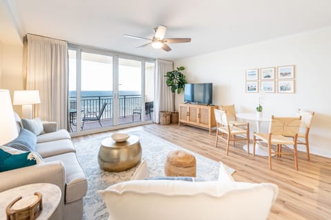 Spacious living room with queen sleeper sofa, 50" smart TV, & view of gulf!