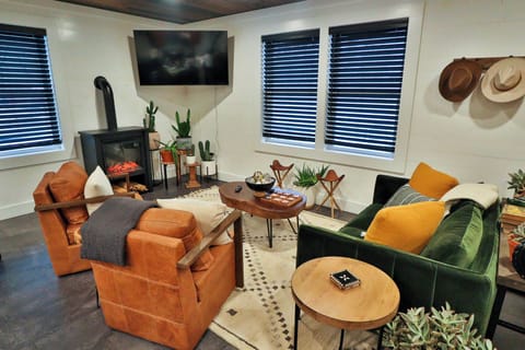 Open fully equipped kitchen, dining area, and living room.