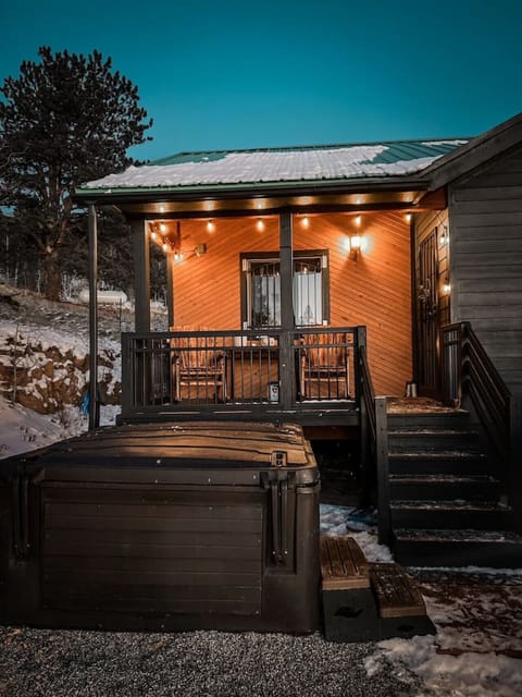 Welcoming entrance with hot tub and porch