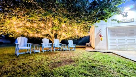 Large quiet property with outdoor seating, firepit, outdoor shower, and a beautiful cherry tree with string lights. Also, you get full access to the garage with bikes, kayaks, and beach equipment!