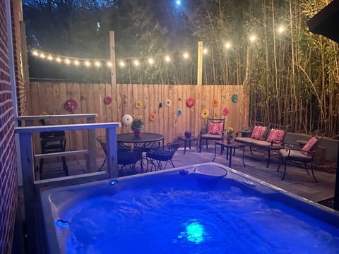 Hot Tub and Back Patio at Dusk - Travelers Post 1