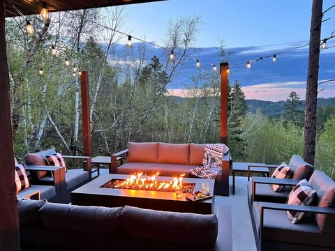 Enjoy a crackling fire around the firepit, sink into comfortable outdoor seating, or soak your stress away in the private hot tub under the stars.