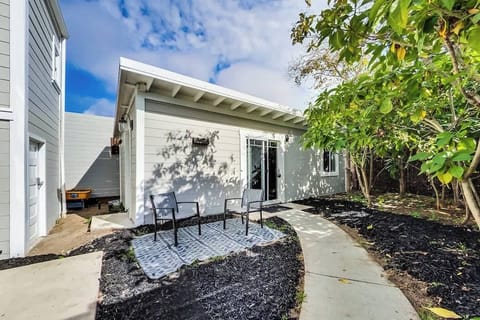 Cottage behind a victorian house.  
The yard/patio/outdoor space is shared with the main house.