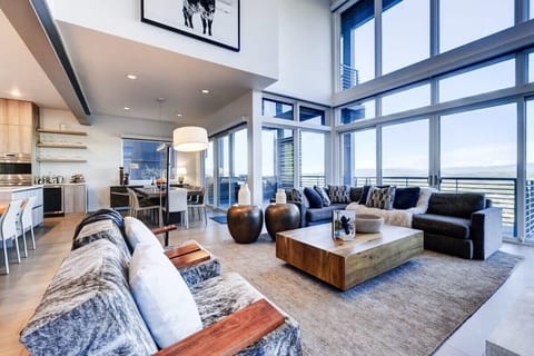 Great Room with massive windows looking out to the Uinta valley and mountains