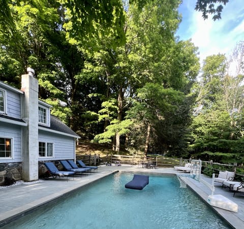 Gunite pool with full sun exposure, pool floats, and toys for the whole family