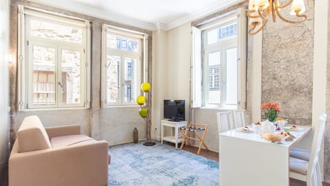 Sunlight streams into this elegant living space, offering a comfortable sofa and a dining area for memorable gatherings.\n#LivingArea #BrightSpace #LovelyStay
