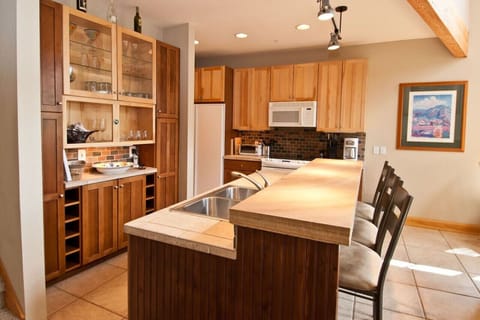 Have a pre-dinner cocktail at the kitchen bar that sits 3 people